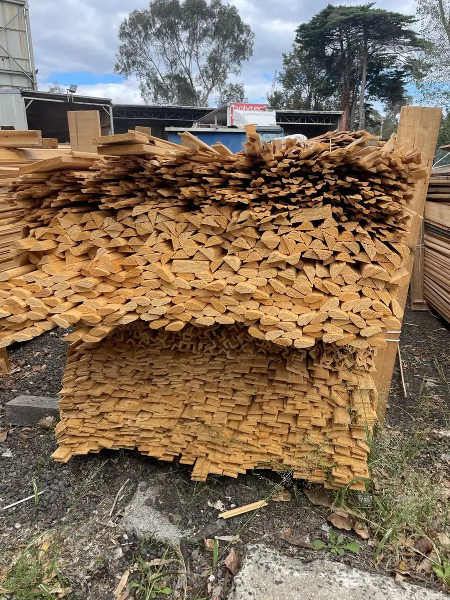 Reclaimed timber stacked outside the yard