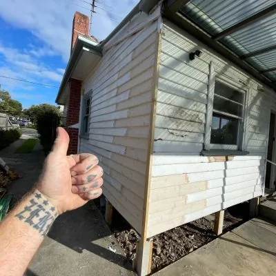 Weatherboard wall part way through being replaced