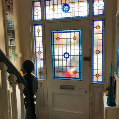 Restored front door with a stained glass surround