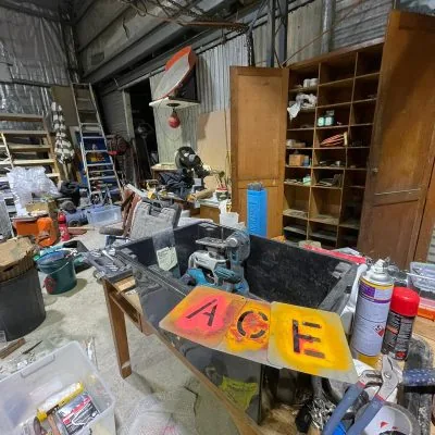 The workshop with the ACE sign on the wall